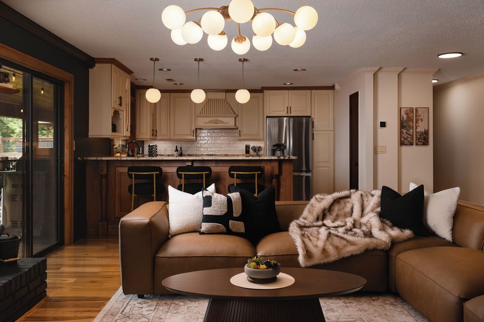 {Living Room} Settle into the oversized sectional while staying connected to the open kitchen and dining spaces—perfect for relaxed mornings, movie nights, and gathering with the whole group.