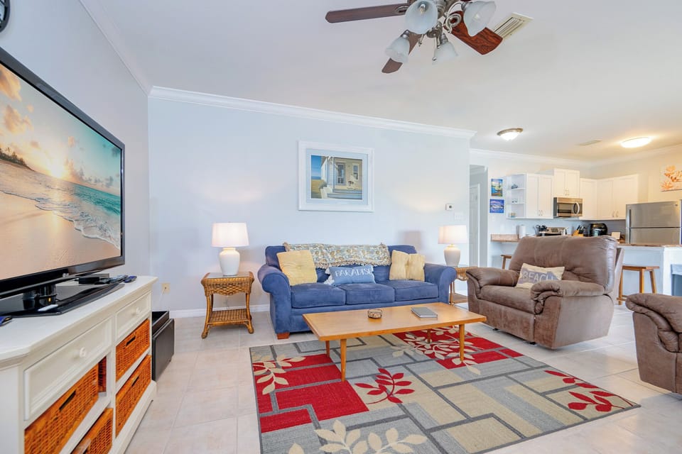 Bright lamps glow beside the plush sofa in the living room where you relax and stream your favorite show