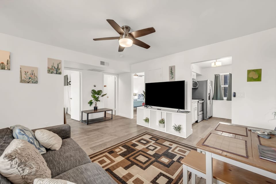 Spacious living room with comfortable seating and smart TV.