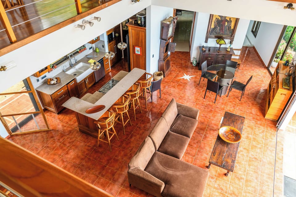 Open-concept living and dining area with bar seating — designed for gathering and entertaining