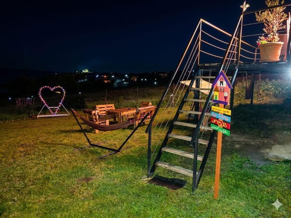handrail, child friendly, summer, staircase, outdoor, outdoor space, nighttimePhoto of the yard
