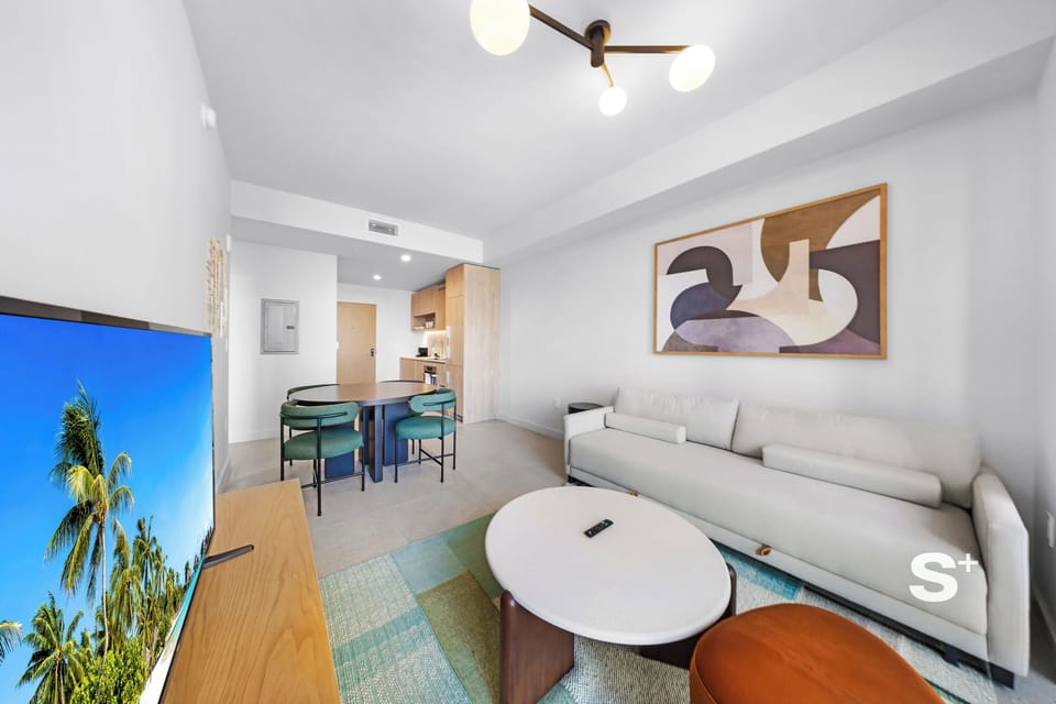 Condo, Balcony, City View | Living area | 36-inch Smart TV with cable channels
