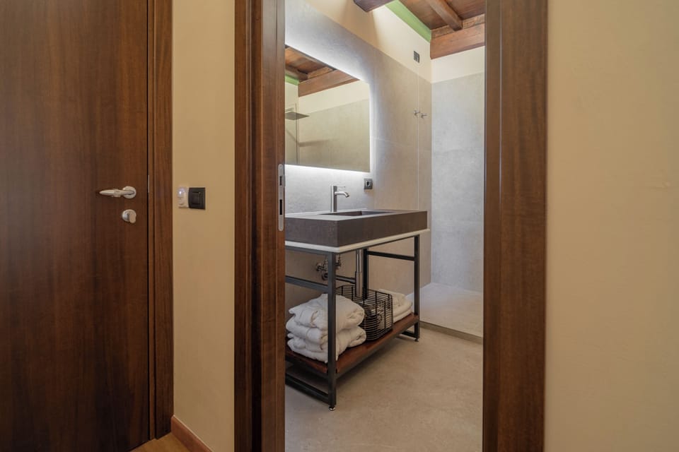 Shower, hair dryer, slippers, towels