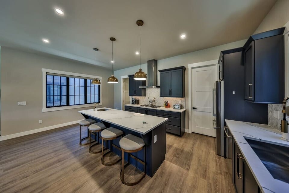 Fully stocked chef`s kitchen with bar seating