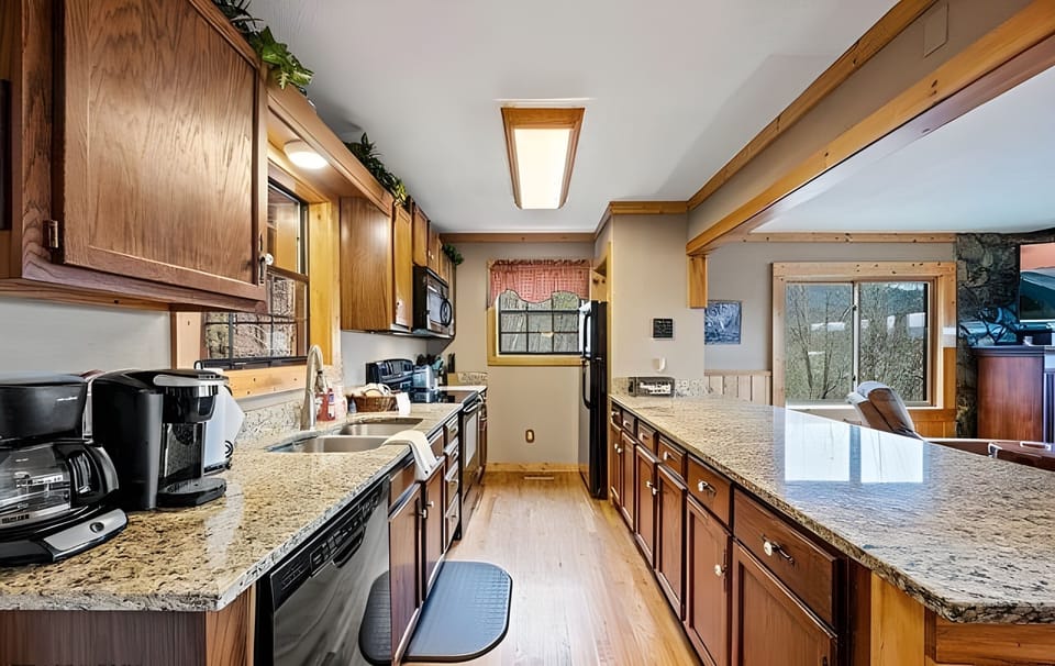 Everything you need to feel at home. The kitchen comes fully equipped with a dual coffee maker (drip and Keurig), expansive granite countertops, and plenty of cabinet space. Perfect for preparing full meals or packing snacks for a day out.