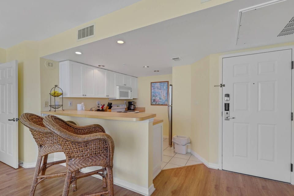 The breakfast bar offers the perfect place to enjoy a quick bite, while the open kitchen makes preparing meals easy and convenient.