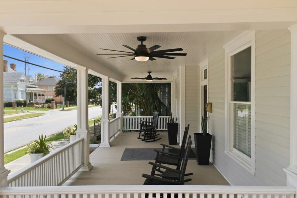 Shaded Veranda Comfort: Heavy-duty outdoor ceiling fans gently circulate the air under our grand porch roof, keeping your morning coffee ritual cool and peaceful.