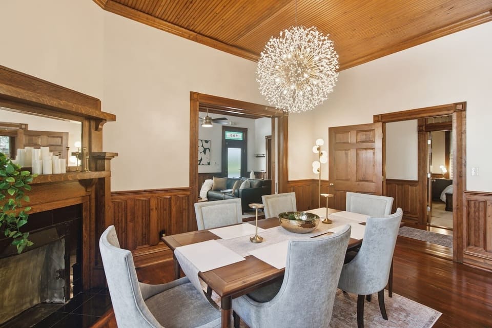 Seamless Entertaining: The open-concept doorway allows a natural visual and social flow between the formal Dining Room and the cozy Living Room social circle.