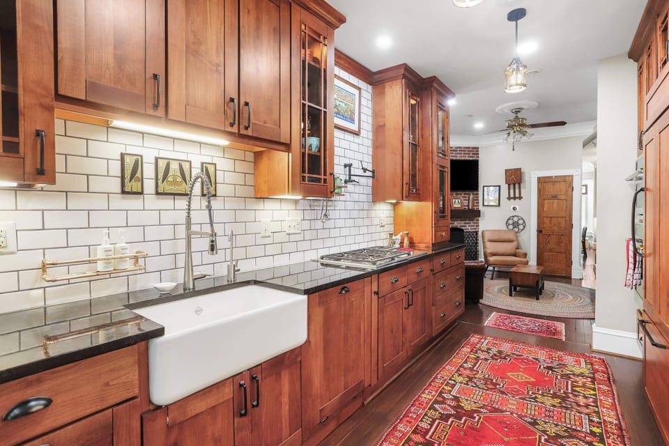 Fully equipped kitchen with view of living room area