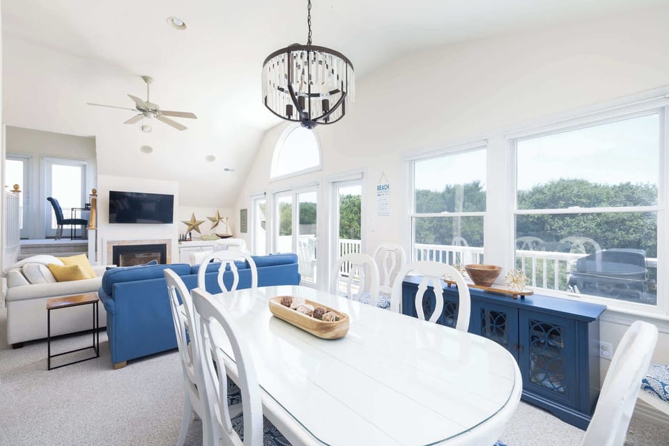Dining Area with Ample Seating, Expansive Windows, and an Open-Concept Layout that Connects Effortlessly to the Kitchen and Living Room