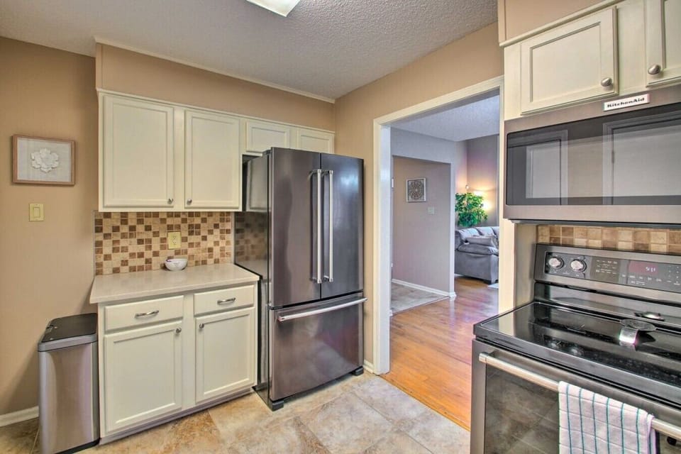 Kitchen | Stainless Steel Appliances | Tile Backsplash & White Cabinetry