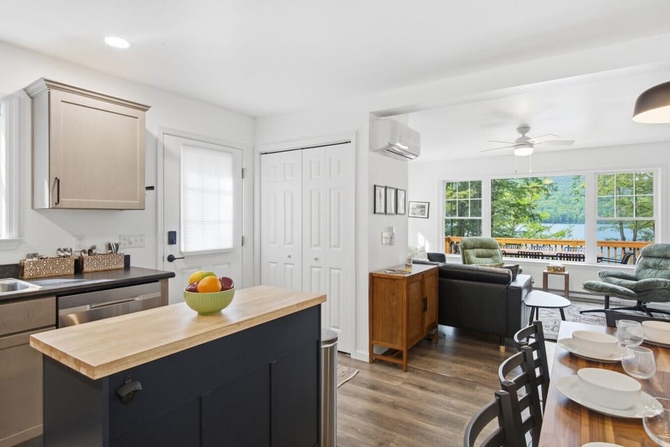 Bright, open living with a cozy kitchen and stunning lake views just steps away.