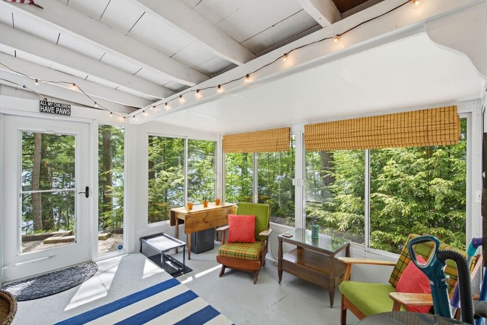 Relax and unwind in the bright screened porch