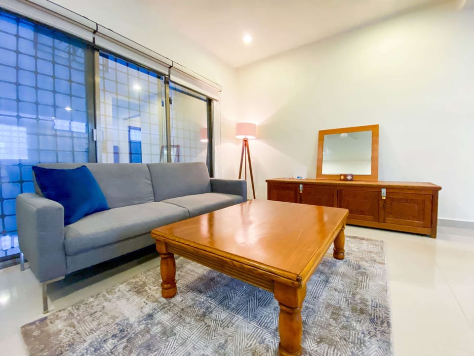 Relax in a bright, open living room after exploring Playa