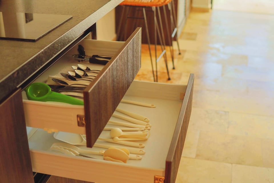 Kitchen drawer stocked with utensils and essentials for easy meals.