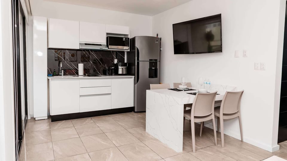 Functional kitchen and dining area with the essentials for coffee, snacks, or simple meals during your stay.