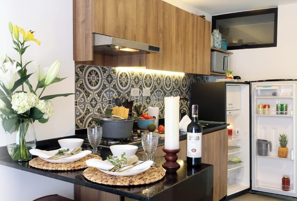 Spacious open living area with a fully equipped modern kitchen.