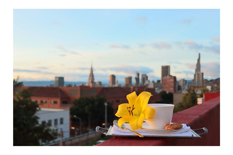 Coffee with panoramic sunset views over Historic Bogotá from our rooftop.