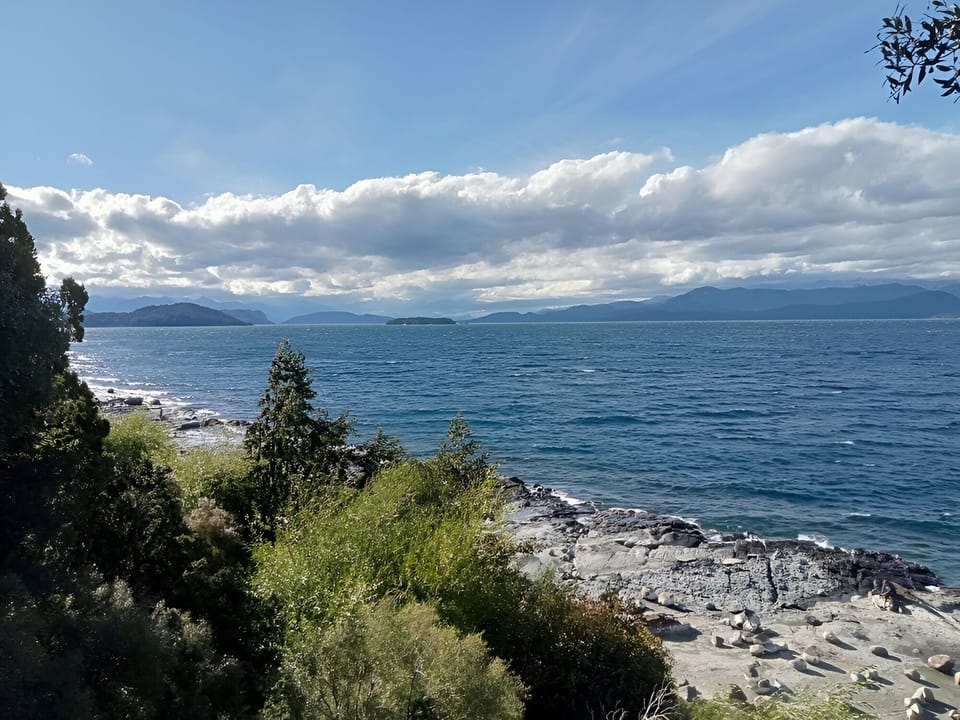 Unwind by the shoreline as waves sparkle under open skies.