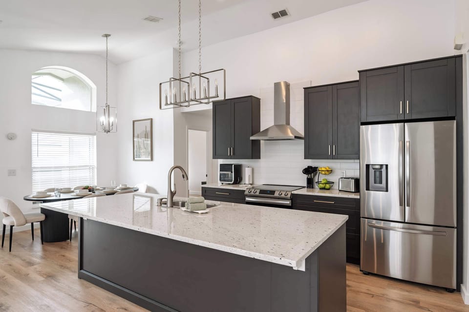 Modern kitchen with a large island and stainless steel appliances