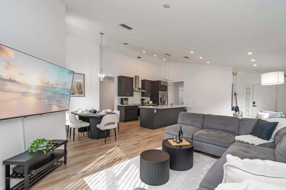 Open-concept living area with modern kitchen and comfortable seating for a relaxing stay.