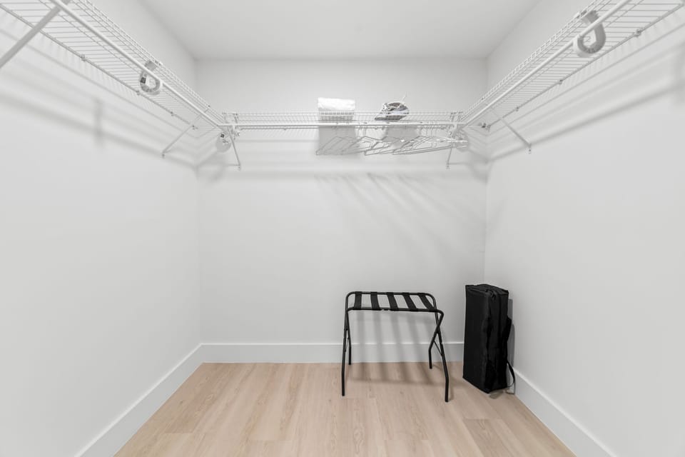 Spacious walk-in closet with plenty of storage.