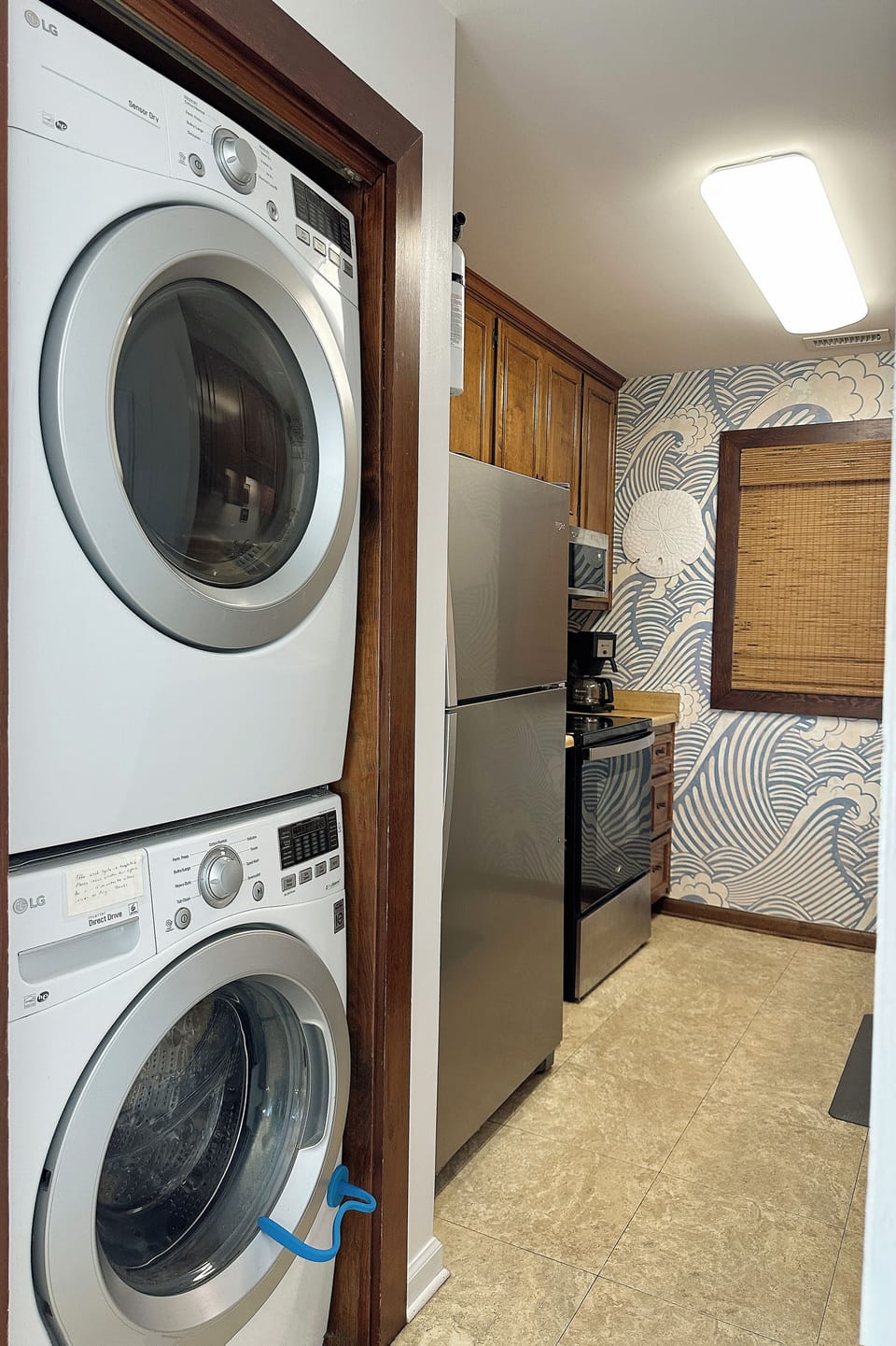 Washer/Dryer located in kitchen hallway.