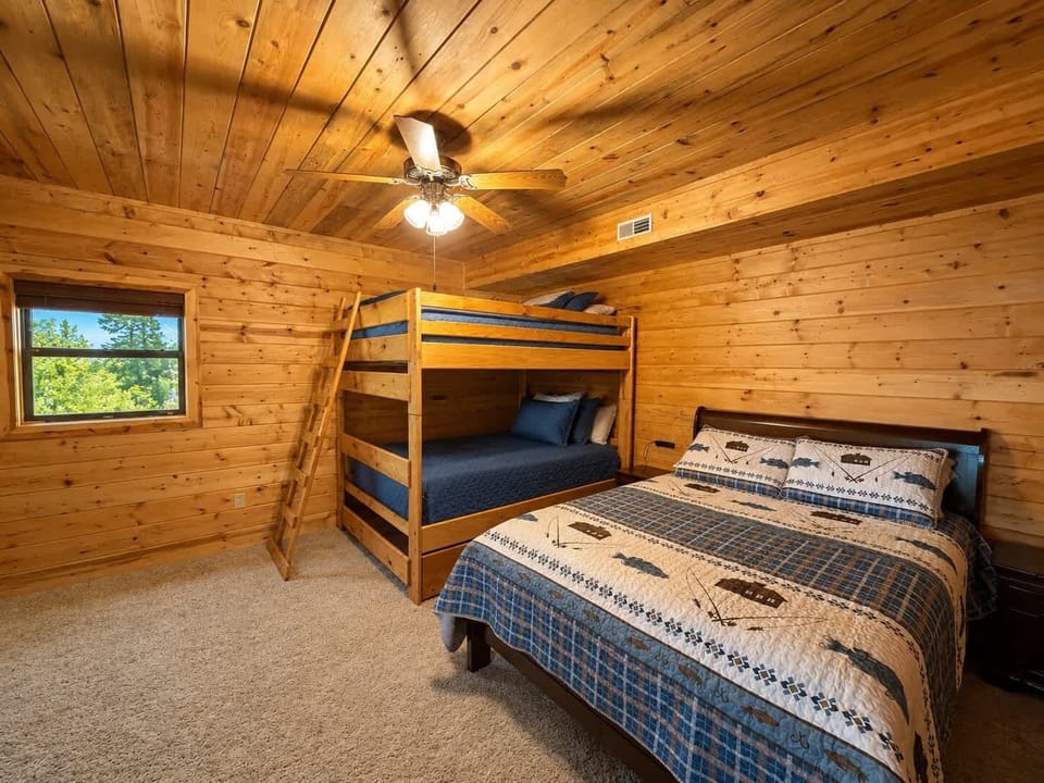 Recharge in the primary king suite, boasting a smart TV, ensuite, & deck access​