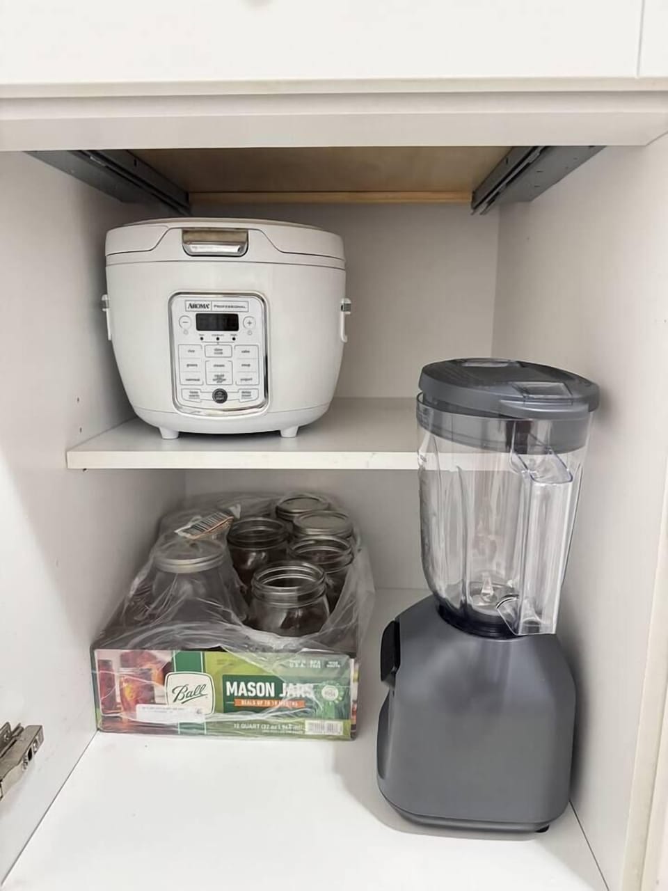 Rice maker and blender under cabinet.