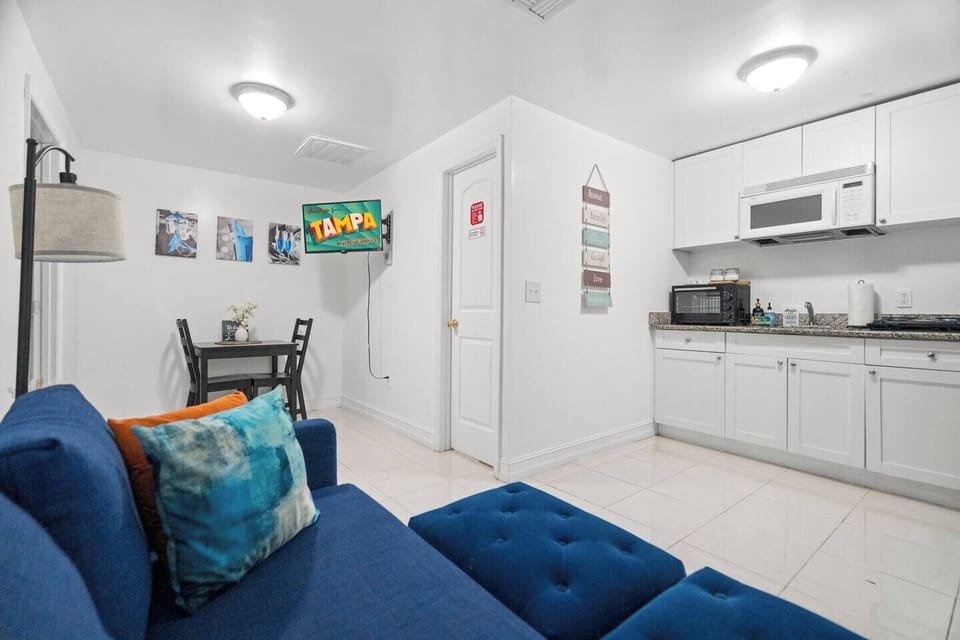 TV can be pulled out for viewing or pushed flush against the wall when not in use. Full kitchenette ready for use