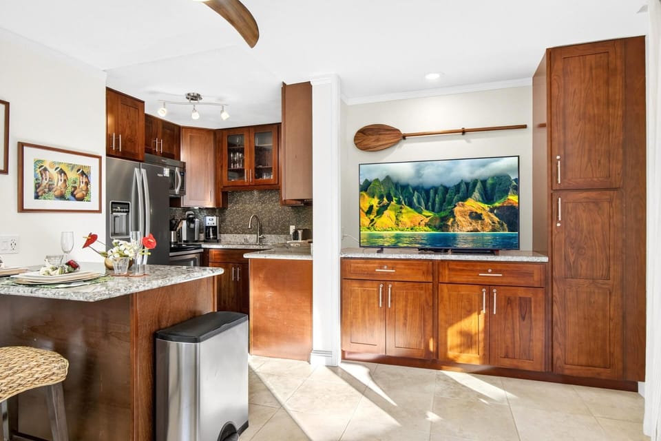 Bright kitchen featuring warm wood cabinetry and island style finishes