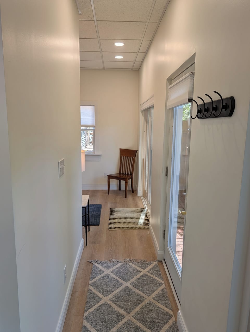 LIVING SPACE: The main entrance of the cute and cozy apartment facing towards where the comfy full-size bed is located