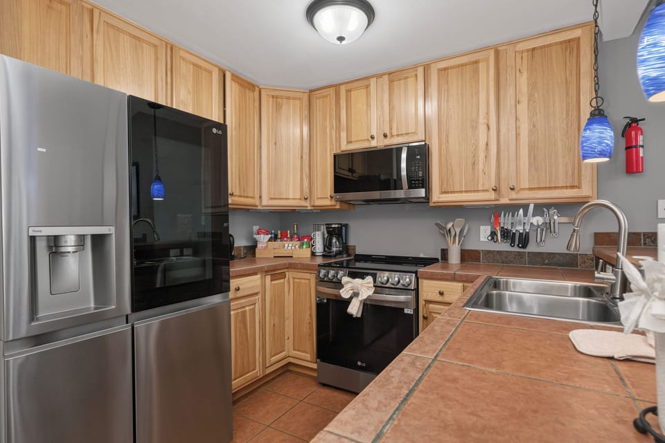 Your fully equipped kitchen features modern stainless appliances, ample counter space, and everything you need to prepare your favorite meals during your stay.