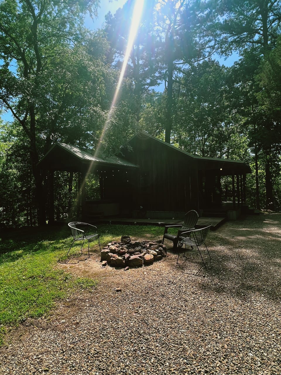 Gather around your private fire pit under towering trees—perfect for toasting marshmallows, sharing stories, and unwinding beneath the stars after a day of adventure.