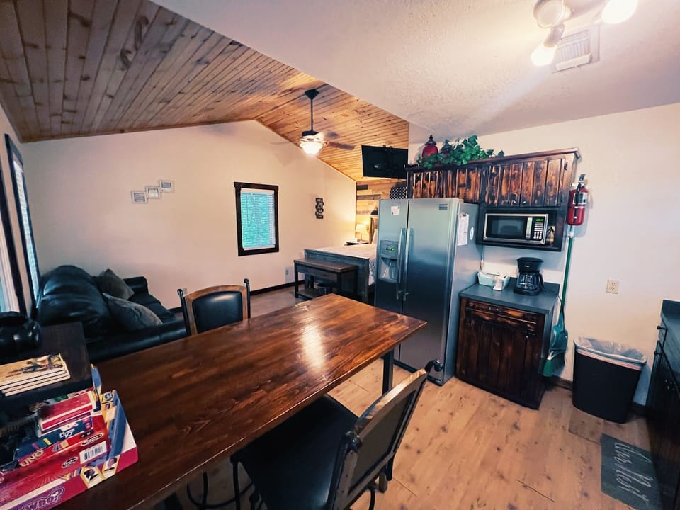 Relax at the cozy dining table with room for four, or unwind on the comfy couch while you plan your day's adventures. The full kitchen makes meal prep a breeze.