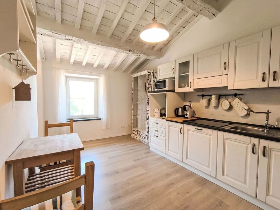 Furniture, Interior Design, Flooring, Wood, Floor, Ceiling, Room, Cabinetry, Lighting, Home