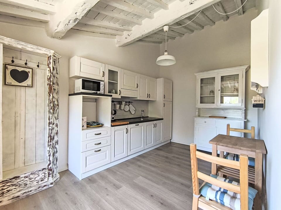 Furniture, Interior Design, Wood, Flooring, Ceiling, Floor, Room, Cabinetry, Kitchen, Home