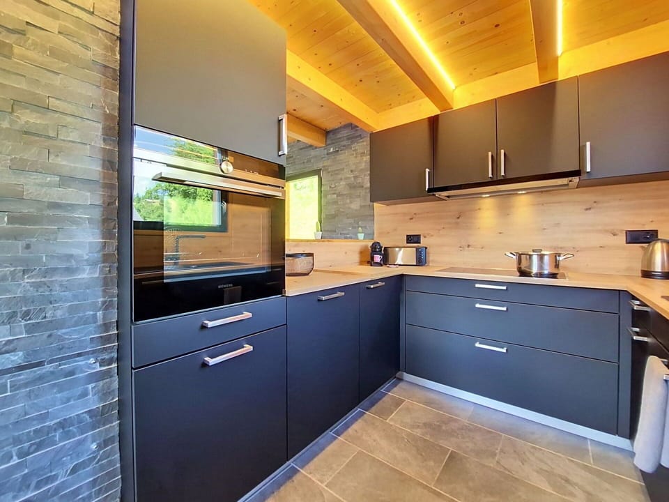 Kitchen, Countertop, Wood, Flooring, Cabinetry, Interior Design, Kitchen Appliance, Furniture, Floor, Major Appliance
