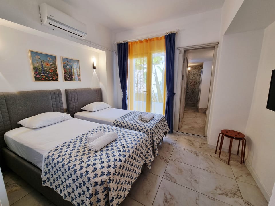 Economy Twin Room, Balcony, Garden View | Premium bedding, WiFi (free), bed sheets