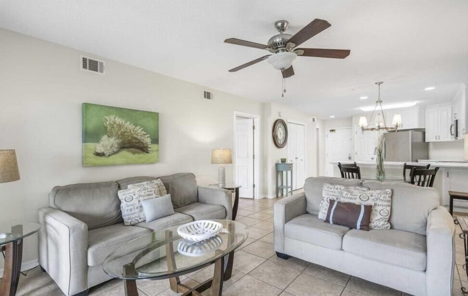 Comfortable living room with plenty of seating for family movie nights or relaxing after the beach.