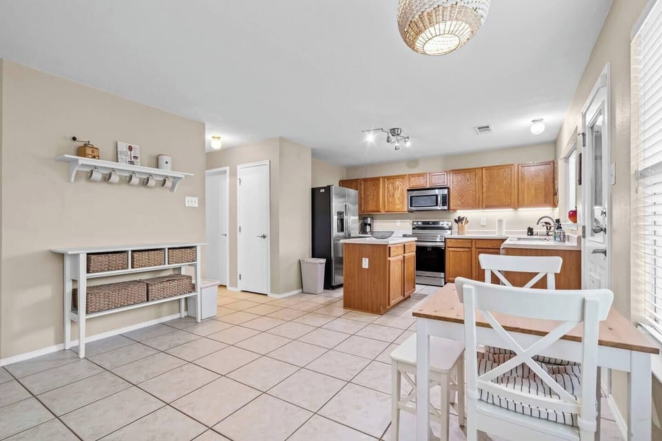 Bright, airy kitchen with a spacious island and coffee station. ☕️
