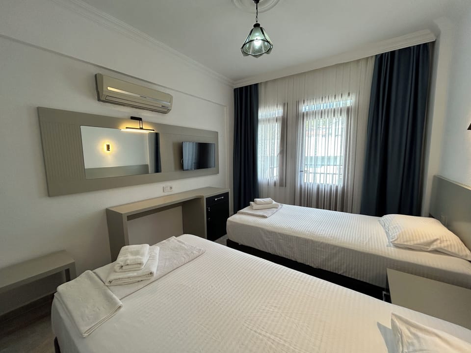 Twin Room, Balcony, Garden View | Premium bedding, laptop workspace, WiFi (free), bed sheets