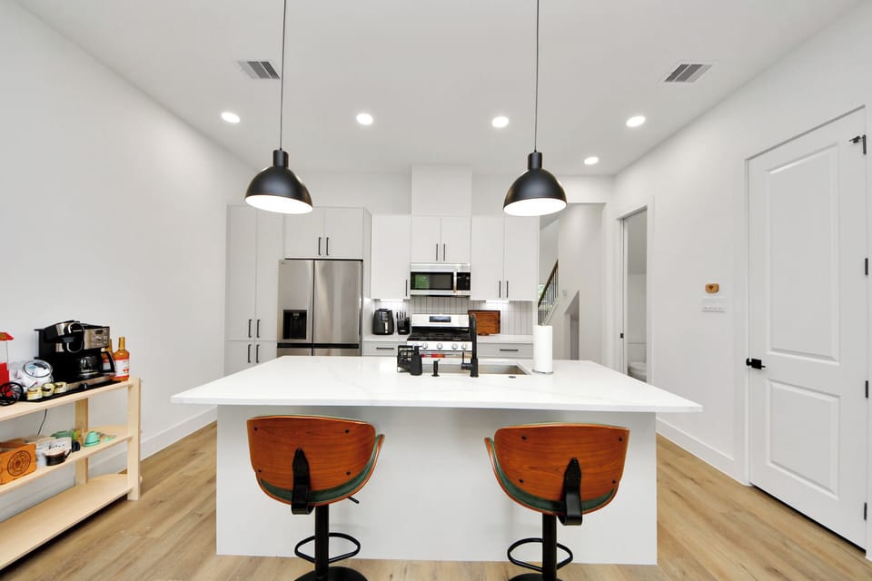 Bright modern kitchen with large island seating and sleek finishes