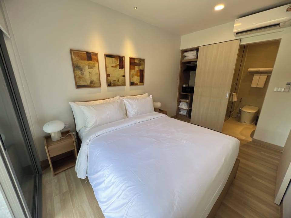 Deluxe Condo, Kitchenette, Garden View | Iron/ironing board, WiFi (free)