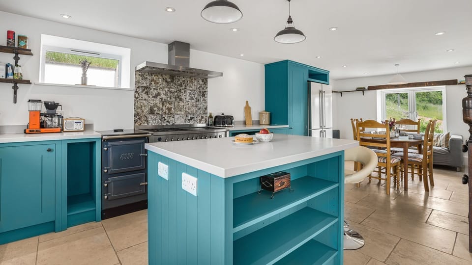 The large oven and hob and Aga are ideal for cooking up delicious family meals