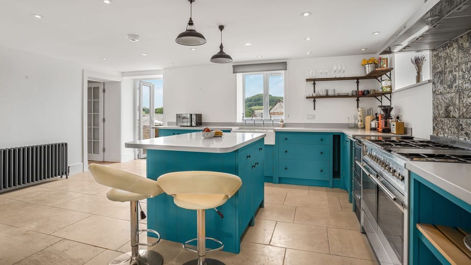The kitchen leads to a private patio for outdoor dining