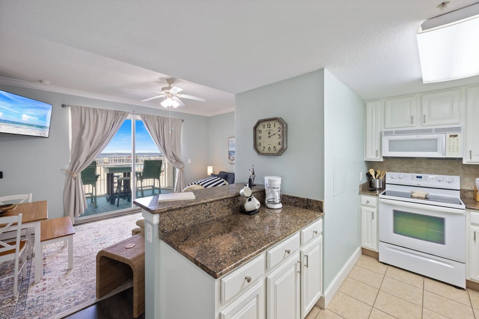 Watts Up Condo - Harbour Pointe 104 by PKRM - You are not required to cook on vacation, but this cute kitchen is fully equipped if you want to.