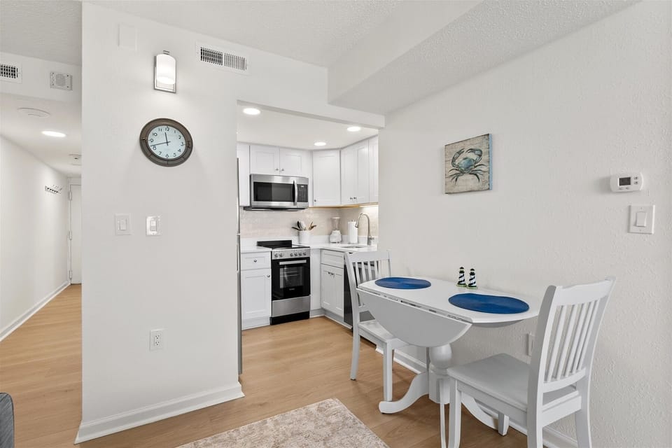 Grab a quick breakfast or enjoy a cozy dinner at the intimate dining table set for two.