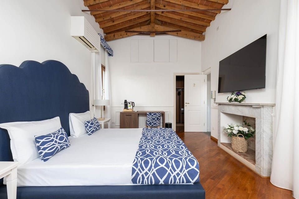 Superior Quadruple Room, City View | Premium bedding, down comforters, minibar, in-room safe