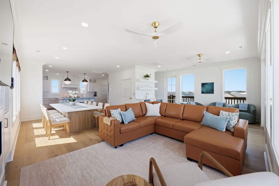 Living and dining spaces designed for effortless oceanfront gatherings with panoramic views from every angle